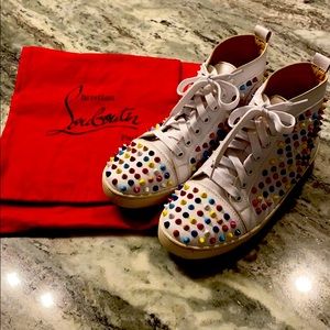 Christian Louboutin sneakers, with shoe bags.